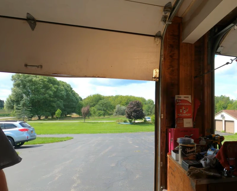 Impact Damage before garage door repair in Tallahassee, FL