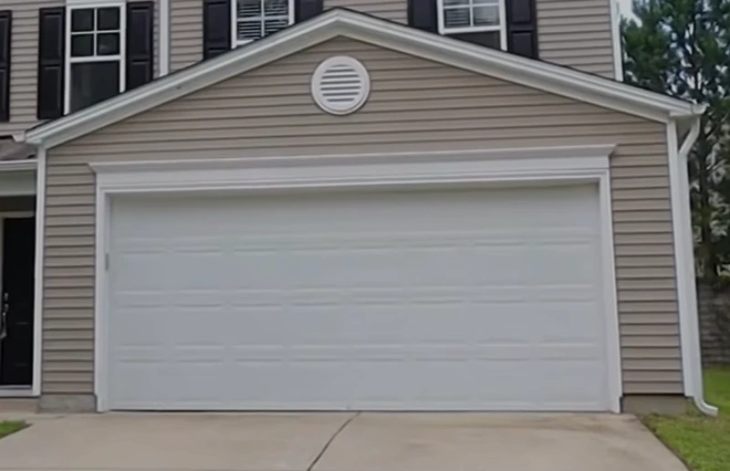 Dented Door after garage door repair in Tallahassee, FL