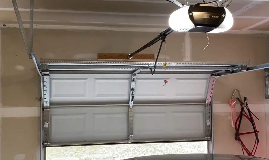 Repaired garage door after spring and track repair