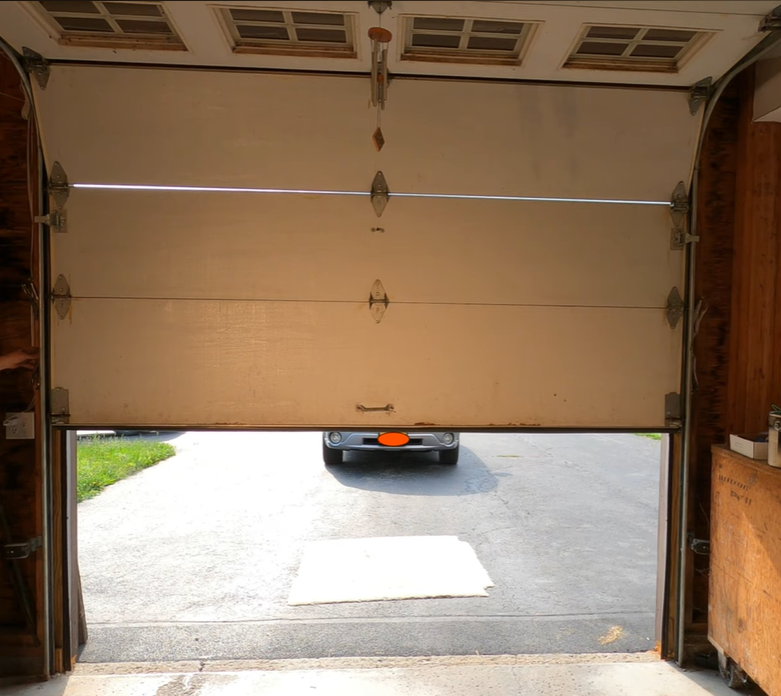 Repaired wood garage door after service